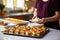 woman assembling bbq pork sliders on table