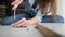 Woman assembling DIY furniture at home.