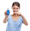 Woman, asthma pump and smile pointing inhaler for medical solution, respiratory or breathing against white studio