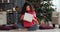 Woman astonished on opening Christmas present