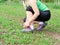 woman athlete tying running shoes.