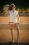 Woman athlete in uniform hold tennis racket at net