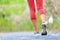 Woman with athletic legs jogging and running