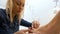 Woman is attended by specialist performing professional pedicure at a beauty parlor