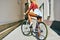 woman back on sport style fixed gear bicycle outdoor