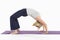 Woman in backbend yoga pose