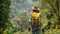 Woman with backpack hiking on a footpath in tropical forest. Solo female tourist outdoors