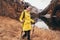 Woman with backpack and raincoat hiking