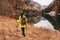 Woman with backpack and raincoat hiking