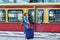 Woman with backpack suitcase at railway station