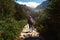 Woman backpack tracking sticks walking mountains Tatras Slovakia