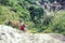 Woman backpacker climbing with backpack in Himalayas, Nepal