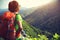 Woman backpacker enjoy the view at mountain peak