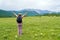 Woman backpacker enjoys the view of nature