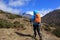 Woman backpacker trekking on himalaya mountains