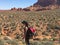 Woman backpacking hiking through grand escalante staircase Reflection Canyon Utah USA