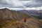 Woman Backpacking on Scenic Rocky Hiking Trail