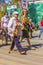 A woman with a badik with a portrait of an ancestor of the participant of the Great Patriotic War is walking along the column `I