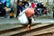 Woman with baggage on railway in Jav, Indonesia