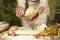 Woman baker hands,pizza kneads dough and making housework making bread, butter, tomato flour