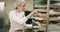 Woman, bakery and inspection checklist in restaurant cake or pastries with paperwork or clipboard. Talking, small