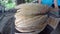 Woman bakes bread in a Georgian clay thorne oven, preparing national baked goods in Georgia, concept of traditional Georgian