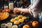 A woman bakes handmade cookies for Halloween.