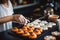 A woman bakes handmade cookies for Halloween.