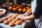 A woman bakes handmade cookies for Halloween.