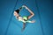Woman, balance and gymnastics competition with exercise, action and body with performance in arena. Female gymnast