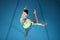 Woman, balance and gymnastics with fitness and competition, action and grace with performance in arena. Female gymnast