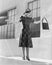 Woman balancing on edge of wall