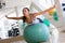 Woman Balancing On Swiss Ball