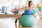 Woman Balancing On Swiss Ball