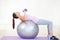 Woman, ball and balance or weight exercise on mat for .cardio or progress training, workout for fitness. Female person