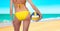 Woman with a ball on a beach