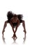 Woman ballerina in black tutu posing on white background