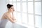 Woman, ballet dancer and thinking at window for future creative, artistic vision or passion goals. Female person