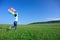 woman with balloons on green grassland