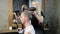 Woman barber drying man\'s head