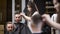 Woman barber making haircut to male customer. View of reflection of the scene
