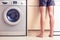 Woman with bare legs in kitchen