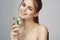 woman with bare shoulders cucumber health drink Fresh