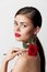 Woman with bare shoulders Red lips pure luxury skin makeup