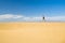 Woman barefoot running on sand desert dunes