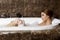 Woman in bath relaxing. Closeup of young woman in bathtub bathing