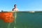 Woman bathing in the sea with plastic in the water