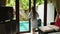 Woman in Bathrobe Opening Glass Windows Doors on Villa, Go Private Swimming Pool
