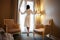 Woman in bathrobe stay near the window in hotel room