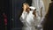 Woman in bathroom drying hair with blow dryer